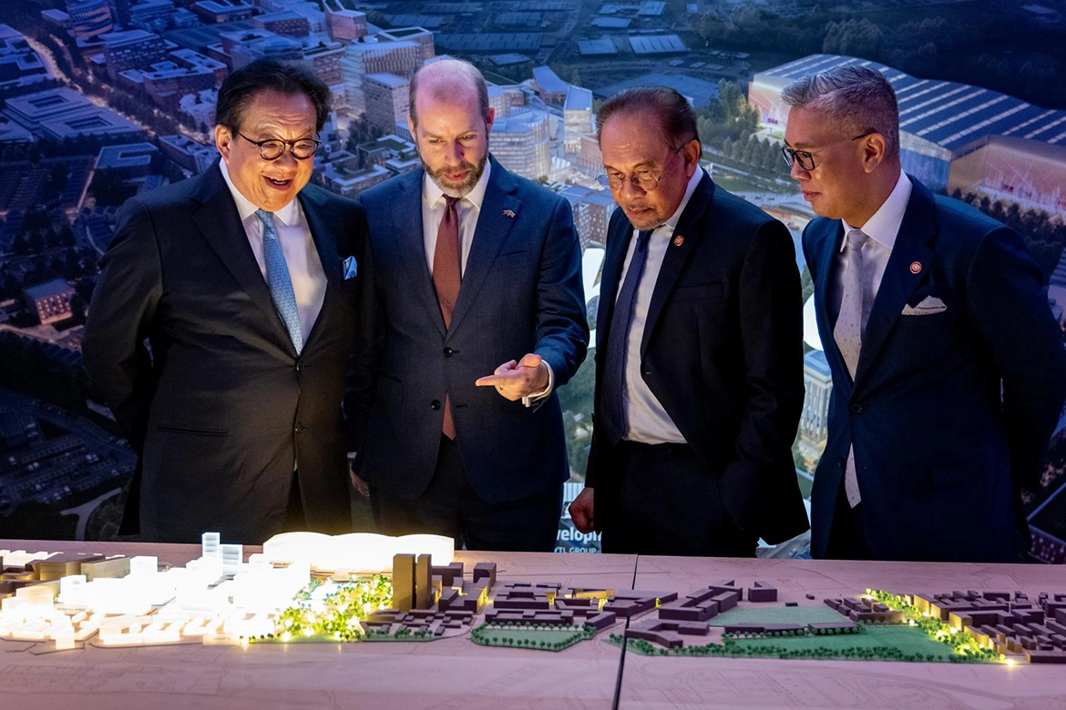 YTL Group Delegates looking at a scale model of the new town Brabazon